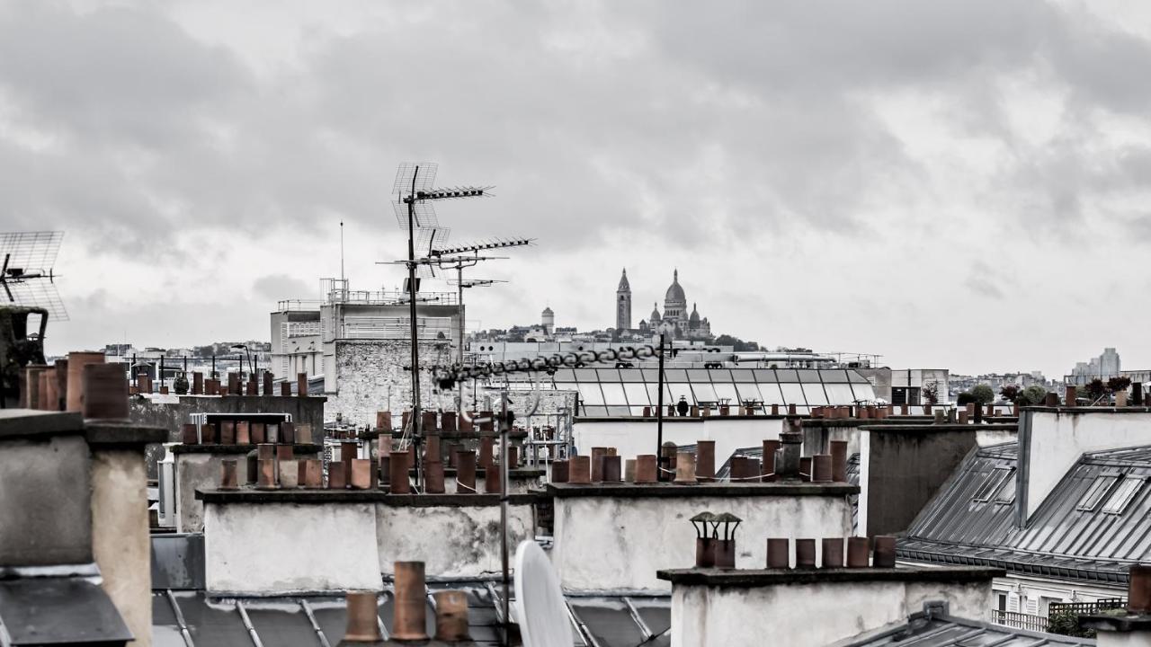 ムッシュー ジョルジュ ホテル&スパ シャンゼリゼ パリ エクステリア 写真 View of Paris rooftops